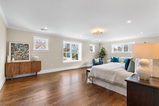 bedroom featuring ornamental molding, visible vents, multiple windows, and wood finished floors