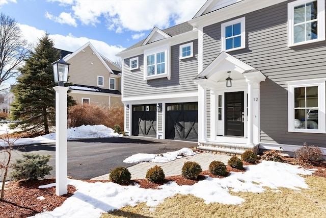 view of front of property with a garage and driveway