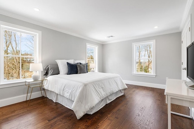 bedroom featuring dark wood-style floors, visible vents, crown molding, and baseboards