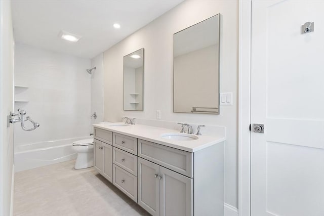 full bath with a sink, bathing tub / shower combination, toilet, and double vanity