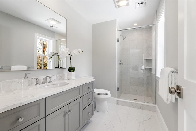 full bathroom featuring toilet, a stall shower, and visible vents