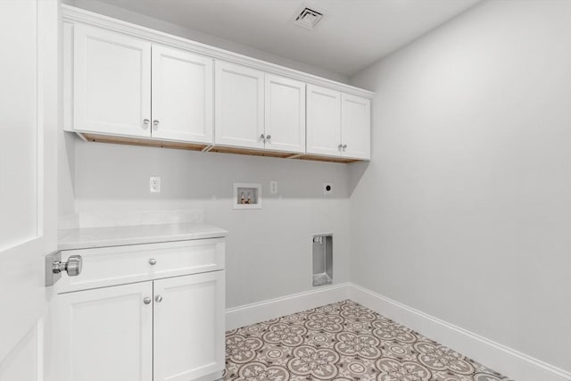 washroom with hookup for a washing machine, visible vents, baseboards, cabinet space, and electric dryer hookup