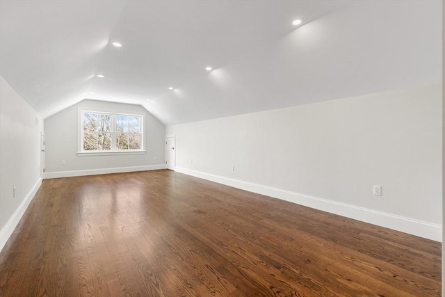 bonus room with vaulted ceiling, recessed lighting, dark wood-style floors, and baseboards