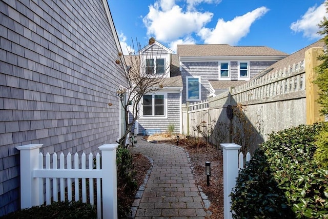 view of home's exterior with fence