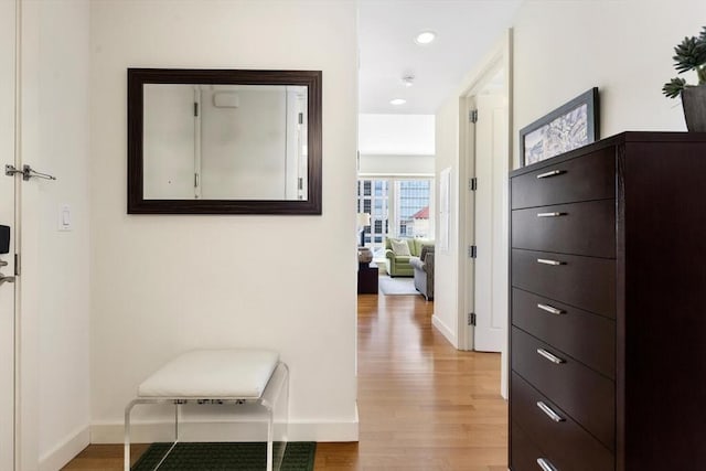 hall with recessed lighting, baseboards, and light wood-type flooring