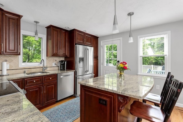 194 Crossfield Rd, Franklin, MA 02038 - kitchen with appliances with stainless steel finishes, plenty of natural light, and light wood-style floors