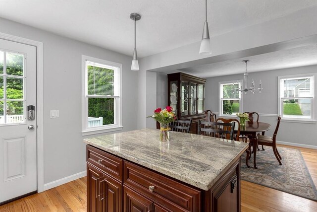 194 Crossfield Rd, Franklin, MA 02038 - kitchen with light wood-type flooring, pendant lighting, and plenty of natural light