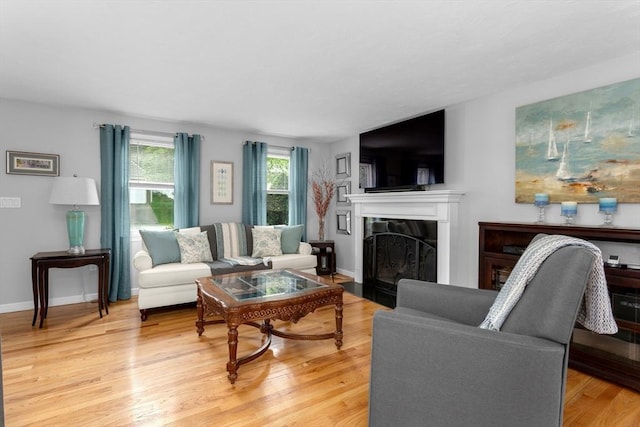 194 Crossfield Rd, Franklin, MA 02038 - living area with a fireplace with flush hearth and light wood-style floors
