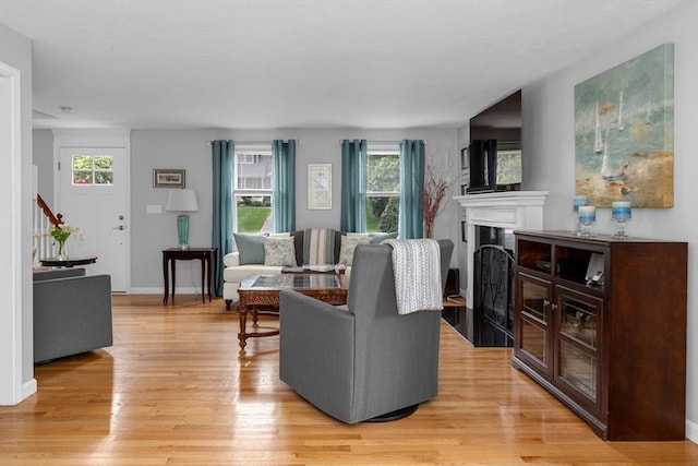194 Crossfield Rd, Franklin, MA 02038 - living room featuring plenty of natural light, light wood-type flooring, a fireplace, and stairway
