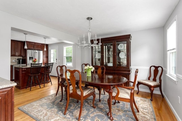 194 Crossfield Rd, Franklin, MA 02038 - dining room featuring light wood-type flooring and a chandelier