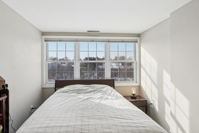 bedroom with multiple windows