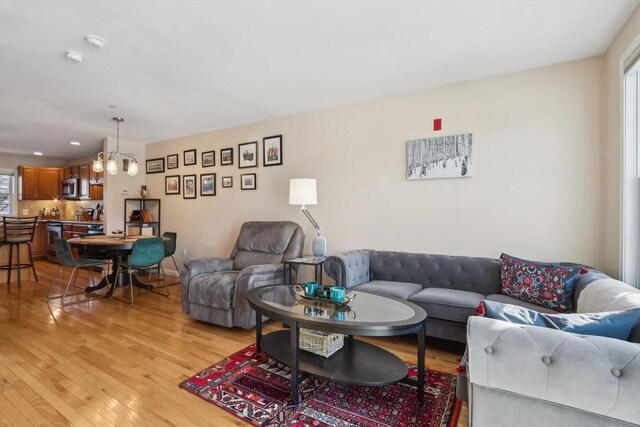 living room featuring plenty of natural light and light wood-type flooring