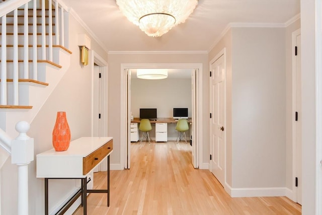 hallway with light wood-style flooring, an office area, stairway, and ornamental molding