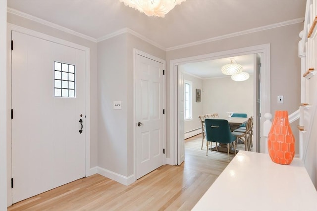 entryway with light wood-style floors, a chandelier, a baseboard heating unit, baseboards, and ornamental molding