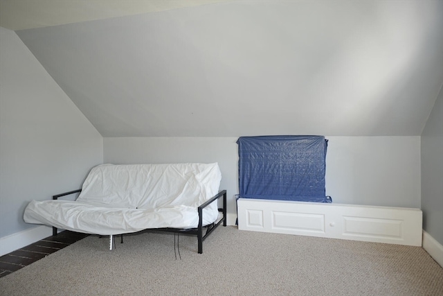 bedroom with vaulted ceiling and carpet