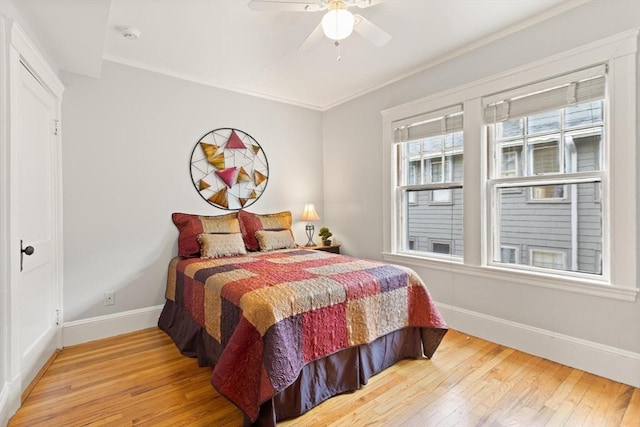 17-19 Newtonville Ave Unit 2, Newton, MA 02458 - bedroom with baseboards, wood finished floors, crown molding, and ceiling fan