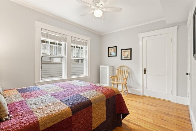 17-19 Newtonville Ave Unit 2, Newton, MA 02458 - bedroom with light wood-type flooring, baseboards, ornamental molding, and a ceiling fan