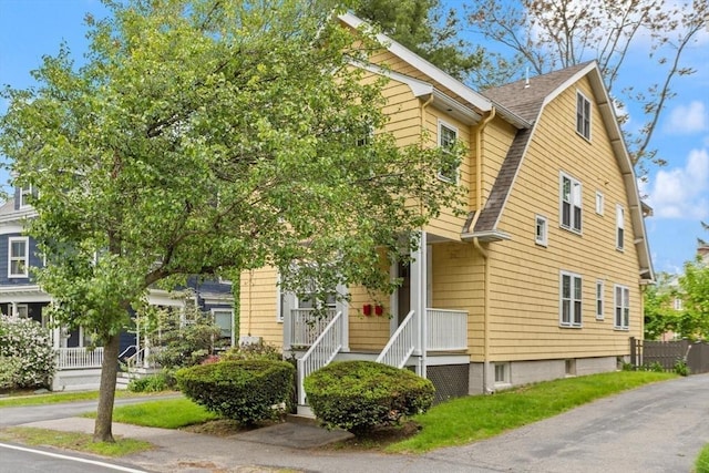 17-19 Newtonville Ave Unit 2, Newton, MA 02458 - view of front facade featuring a shingled roof