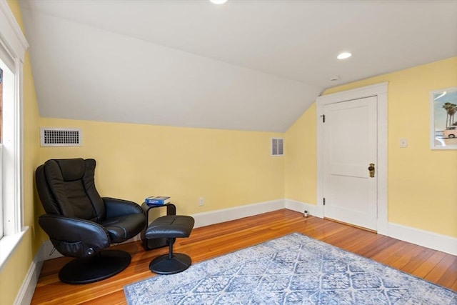 17-19 Newtonville Ave Unit 2, Newton, MA 02458 - sitting room with wood finished floors, baseboards, lofted ceiling, and recessed lighting