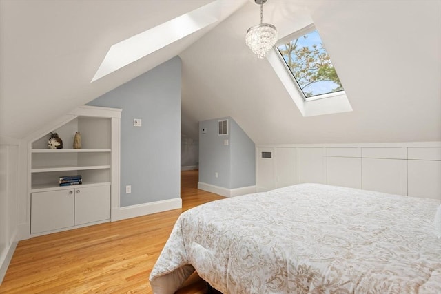 17-19 Newtonville Ave Unit 2, Newton, MA 02458 - bedroom featuring a skylight, light wood finished floors, lofted ceiling, and baseboards
