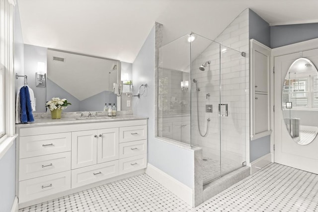 17-19 Newtonville Ave Unit 2, Newton, MA 02458 - bathroom featuring lofted ceiling, a shower stall, vanity, tile patterned floors, and baseboards