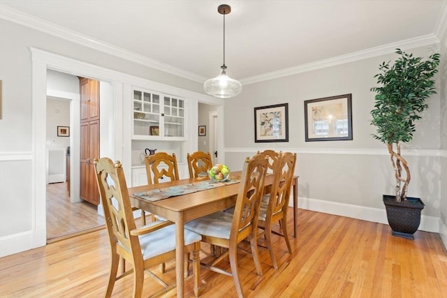 17-19 Newtonville Ave Unit 2, Newton, MA 02458 - dining room featuring light wood-type flooring, crown molding, and baseboards