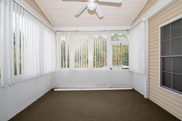 unfurnished sunroom with ceiling fan