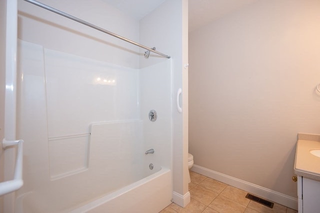 full bathroom featuring vanity, bathtub / shower combination, toilet, and tile patterned flooring