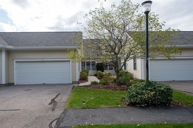 ranch-style house featuring a garage