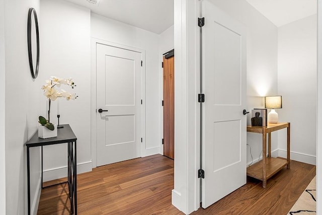 1515 Commonwealth Ave Unit 211, Boston, MA 02135 - hall with wood finished floors and baseboards