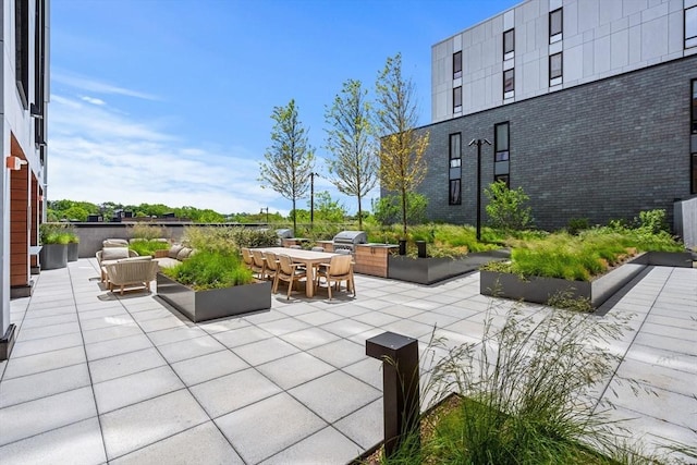 1515 Commonwealth Ave Unit 211, Boston, MA 02135 - view of patio featuring outdoor dining area, grilling area, and outdoor lounge area