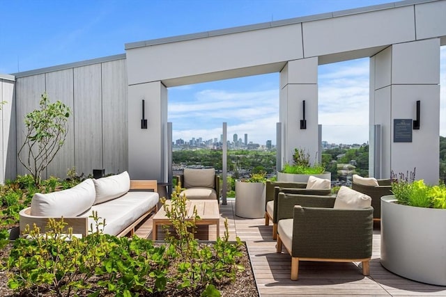 1515 Commonwealth Ave Unit 211, Boston, MA 02135 - view of patio with outdoor lounge area and a skyline view