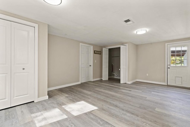 unfurnished bedroom featuring light hardwood / wood-style flooring