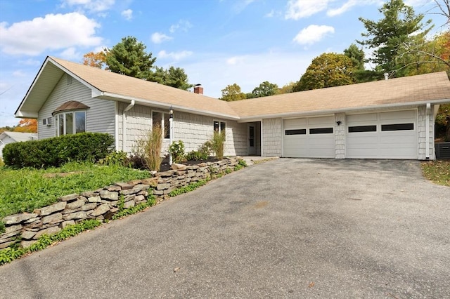 ranch-style house featuring a garage