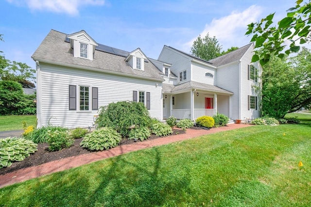 9 Buffalo Run, Southborough, MA 01772 - view of front of property featuring covered porch, a front lawn, and a shingled roof