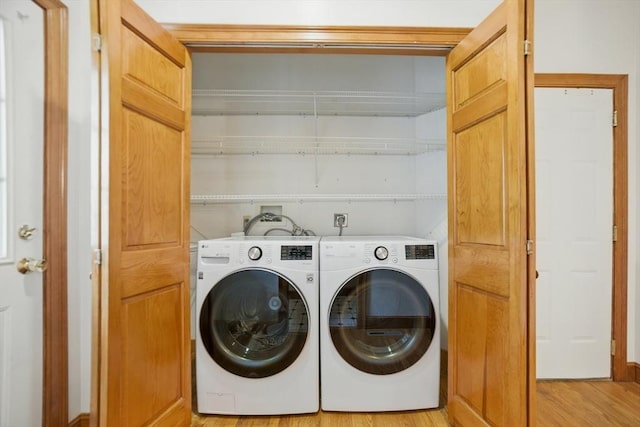 9 Buffalo Run, Southborough, MA 01772 - washroom with washing machine and clothes dryer and light wood-style floors