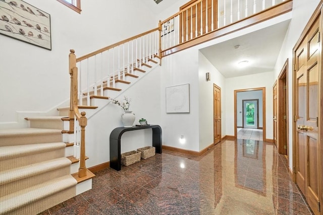 9 Buffalo Run, Southborough, MA 01772 - entrance foyer featuring granite floors, stairway, and a towering ceiling