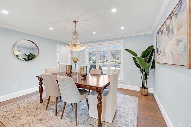 dining area featuring recessed lighting, wood finished floors, baseboards, and ornamental molding