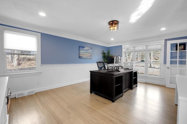 home office featuring visible vents, a wainscoted wall, light wood-style flooring, ornamental molding, and recessed lighting