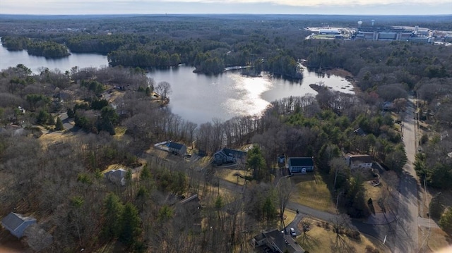 drone / aerial view featuring a view of trees and a water view