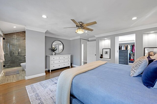 bedroom with recessed lighting, wood finished floors, baseboards, and ornamental molding