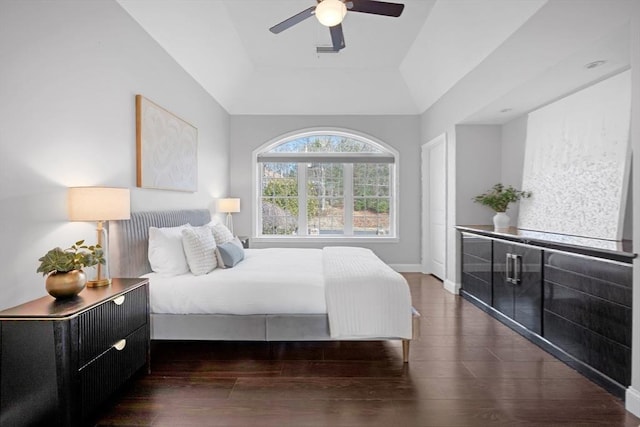 bedroom featuring wood finished floors, baseboards, and ceiling fan