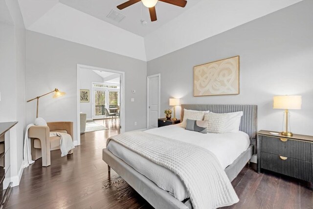 bedroom featuring a ceiling fan, wood finished floors, visible vents, baseboards, and lofted ceiling