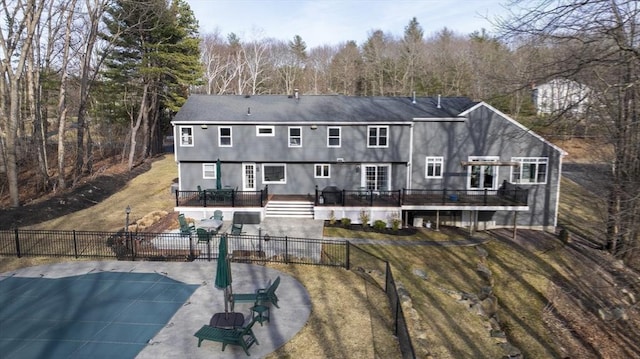 back of house featuring a patio, a deck, and fence