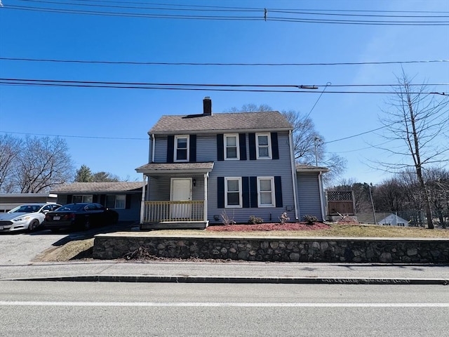 view of front of property with a chimney