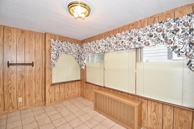 81 Osborne Ter, Springfield, MA 01104 - spare room featuring radiator, wooden walls, and tile patterned floors