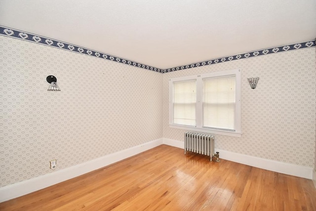 81 Osborne Ter, Springfield, MA 01104 - unfurnished room with radiator and light wood-type flooring