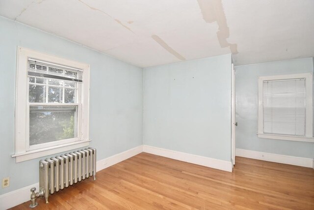 81 Osborne Ter, Springfield, MA 01104 - empty room featuring radiator and wood finished floors