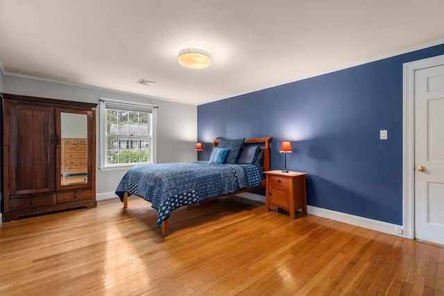 103 Randlett Park, Newton, MA 02465 - bedroom featuring light wood-type flooring and ornamental molding