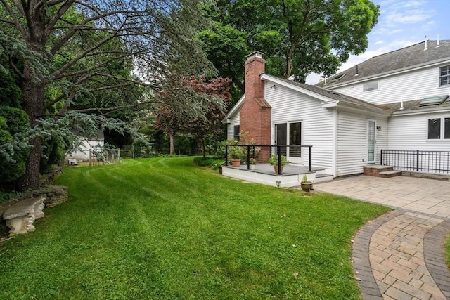 103 Randlett Park, Newton, MA 02465 - view of green lawn featuring a patio area and a wooden deck